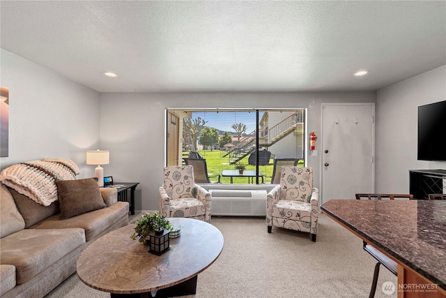 living area featuring carpet floors and recessed lighting