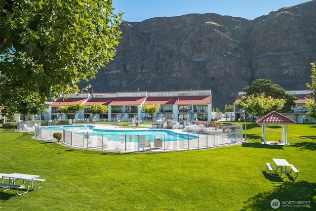 community pool featuring a mountain view and a gazebo