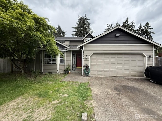 21614 82nd Avenue Ct E, Spanaway, WA 68718 - view of front of home with driveway and a garage