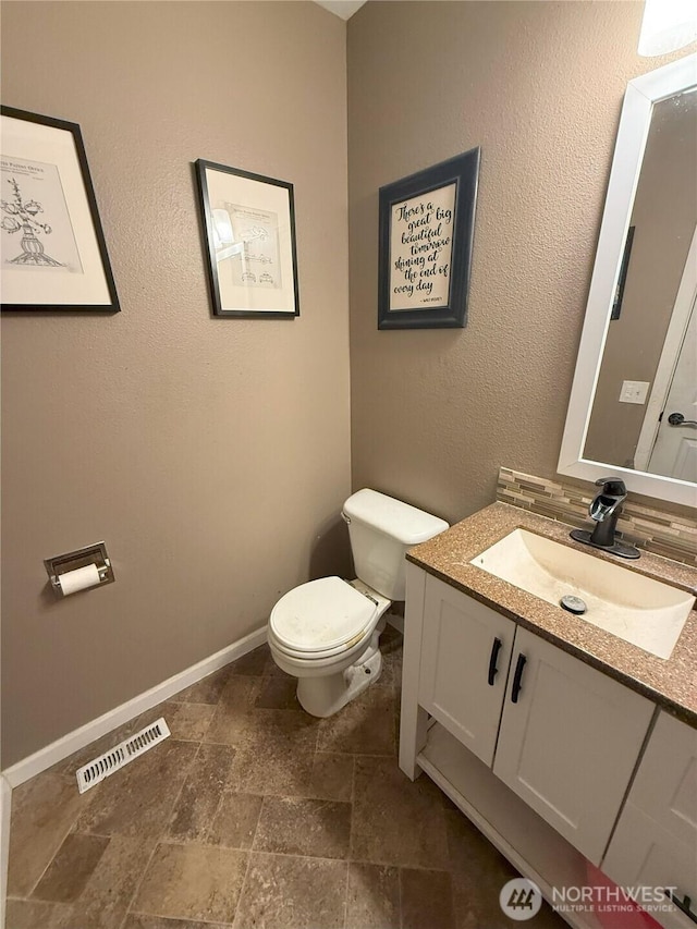 21614 82nd Avenue Ct E, Spanaway, WA 68718 - half bath with toilet, vanity, stone finish floors, and baseboards
