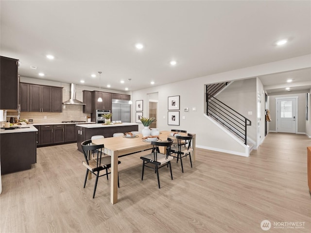 8302 114th Ave SE Unit 29, Newcastle, WA 98056 - dining room featuring stairway, light wood finished floors, and recessed lighting