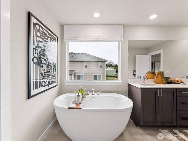8302 114th Ave SE Unit 29, Newcastle, WA 98056 - full bathroom featuring a freestanding tub, vanity, and recessed lighting