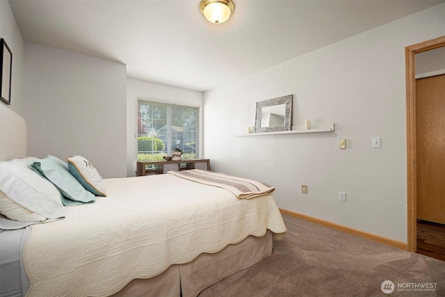carpeted bedroom with baseboards