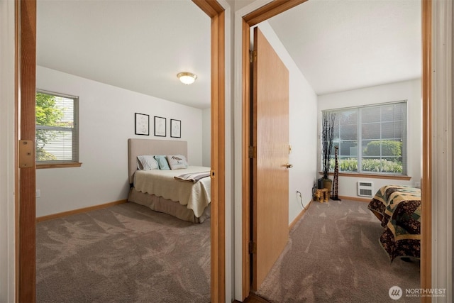carpeted bedroom featuring baseboards