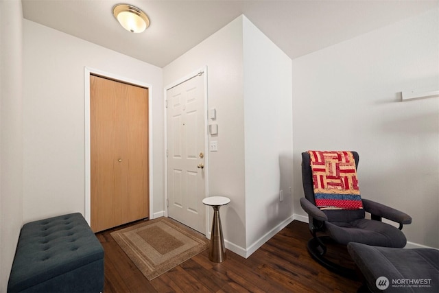 living area with wood finished floors and baseboards