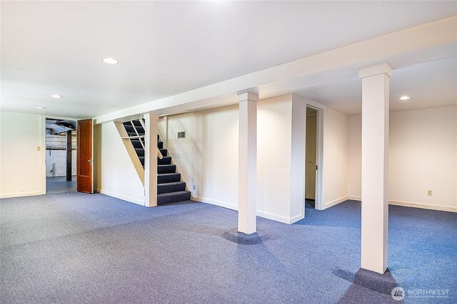 finished below grade area featuring carpet floors, baseboards, stairway, and recessed lighting