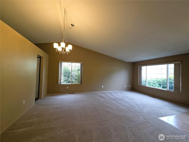 7509 43rd Ave SE, Lacey, WA 98503 - carpeted empty room with plenty of natural light, a chandelier, and baseboards