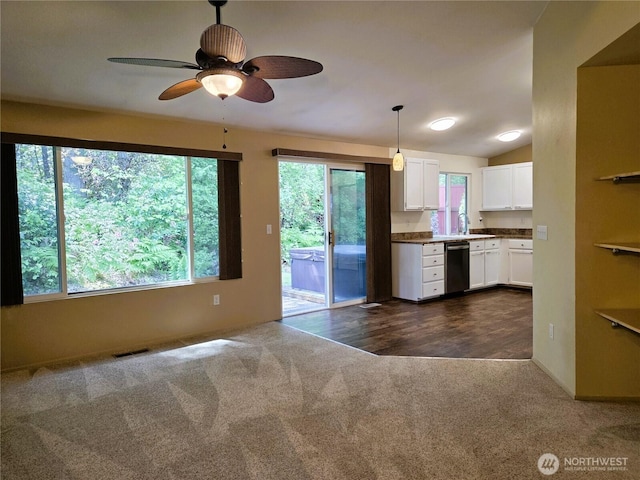 7509 43rd Ave SE, Lacey, WA 98503 - kitchen featuring dishwasher, dark carpet, white cabinets, ceiling fan, and pendant lighting