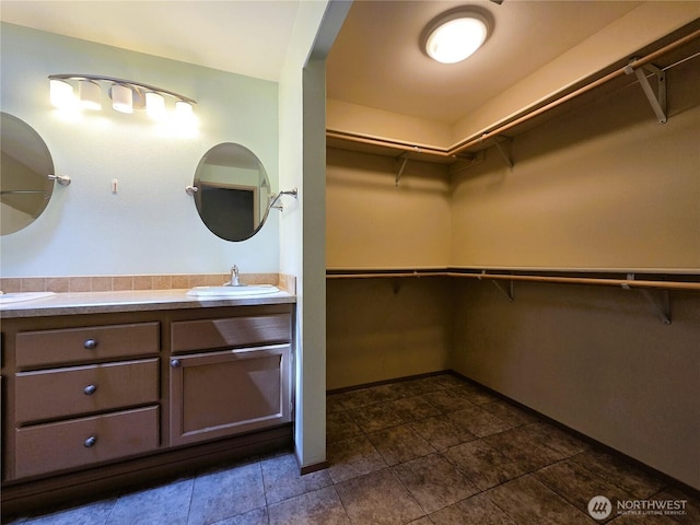 7509 43rd Ave SE, Lacey, WA 98503 - spacious closet with a sink and dark tile patterned floors