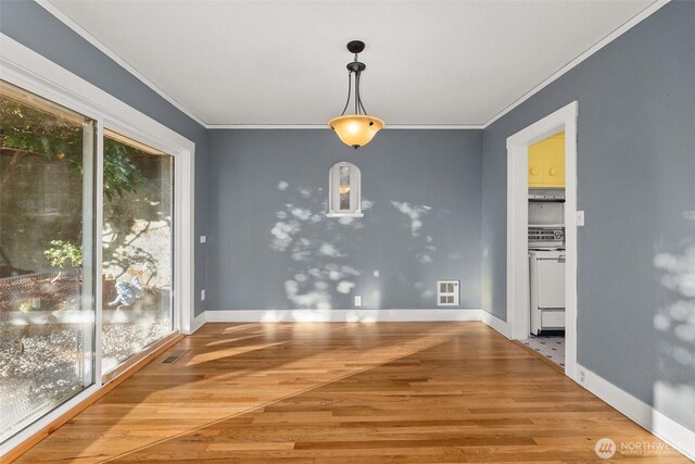 1250 N Broadway St, Aberdeen, WA 98520 - unfurnished dining area featuring healthy amount of natural light, crown molding, and wood finished floors