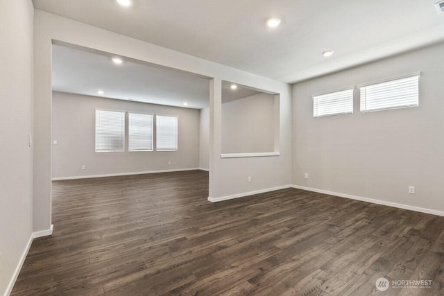 28203 74th Dr NW Unit 82, Stanwood, WA 98292 - empty room featuring healthy amount of natural light, dark wood-style floors, recessed lighting, and baseboards