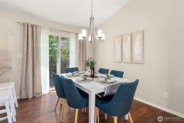 dining space featuring a chandelier, wood finished floors, baseboards, and vaulted ceiling