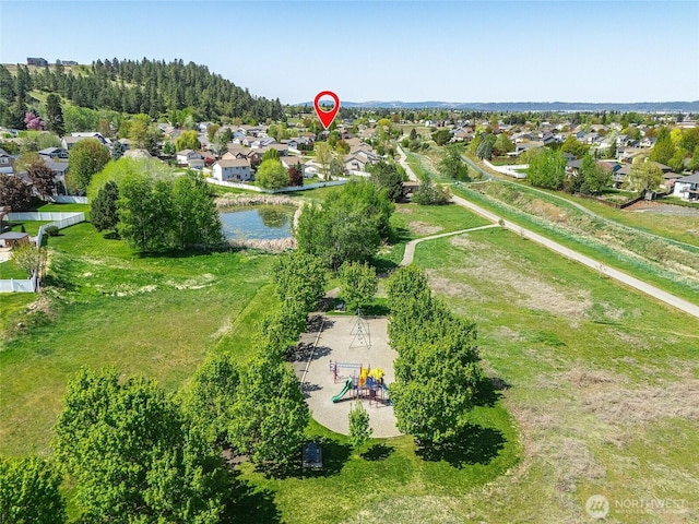 aerial view of property and surrounding area with nearby suburban area and a recreational park