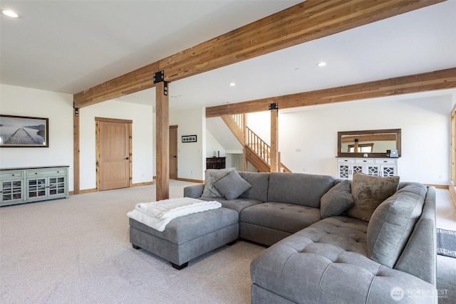 carpeted living room with a barn door, beam ceiling, recessed lighting, stairway, and baseboards