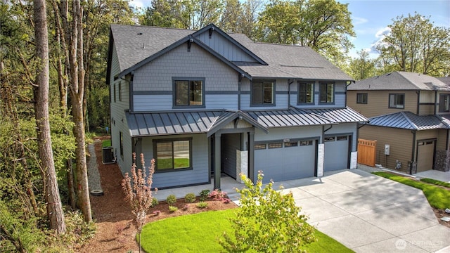 craftsman inspired home with a standing seam roof, driveway, roof with shingles, and a garage