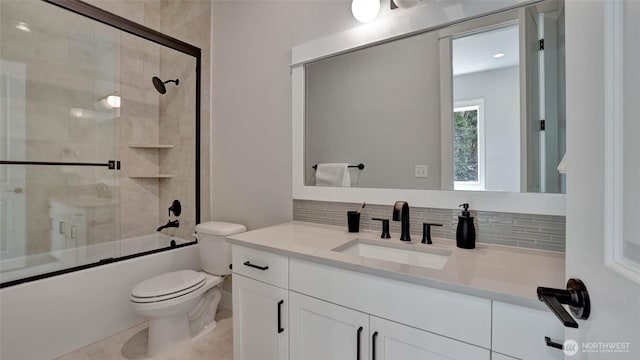 bathroom with toilet, bath / shower combo with glass door, decorative backsplash, vanity, and tile patterned flooring