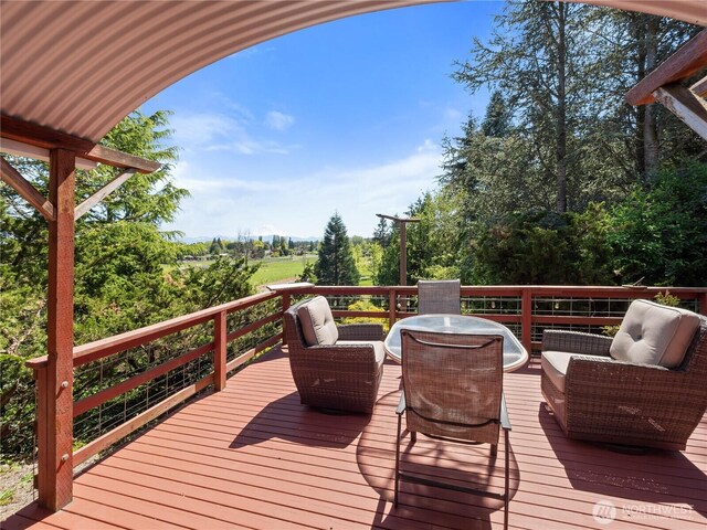 wooden terrace featuring an outdoor living space