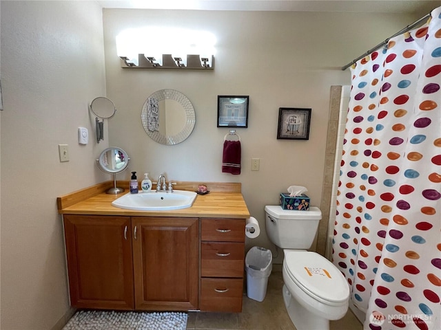 full bath with toilet, vanity, curtained shower, and tile patterned floors