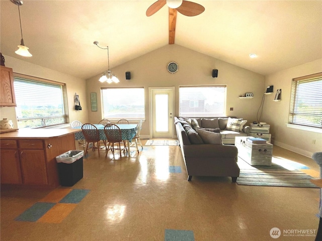 living room featuring a ceiling fan and baseboards
