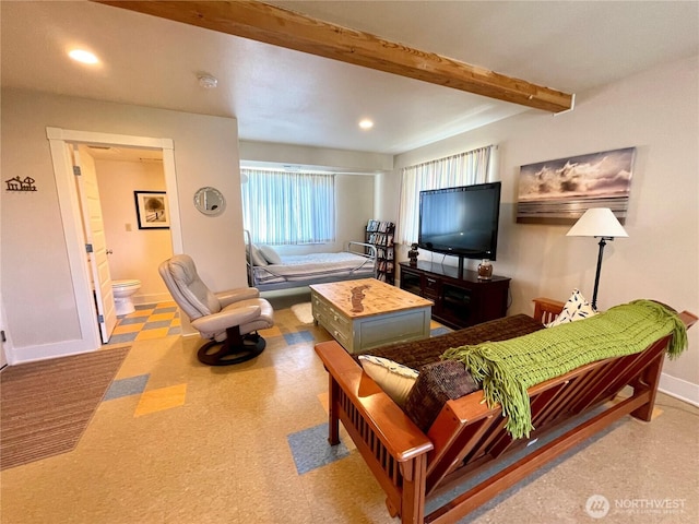 living area with baseboards, beamed ceiling, and recessed lighting