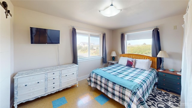 bedroom featuring baseboards