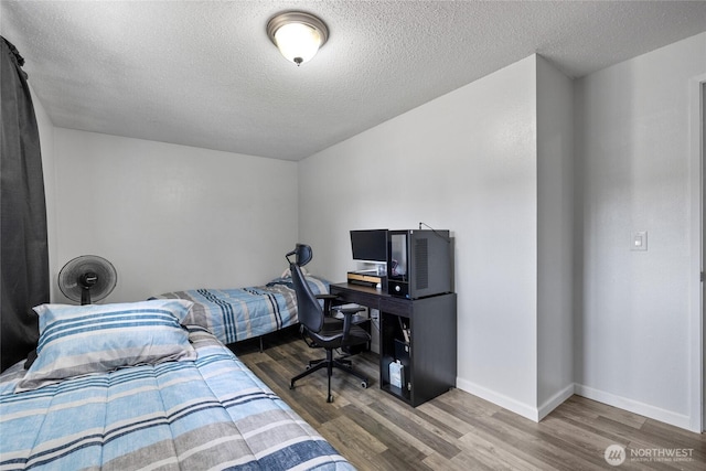 2505 Angela St SE, Lacey, WA 98503 - bedroom featuring wood finished floors, a textured ceiling, baseboards, and a desk