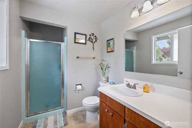 2505 Angela St SE, Lacey, WA 98503 - full bath featuring vanity, toilet, a shower stall, and baseboards