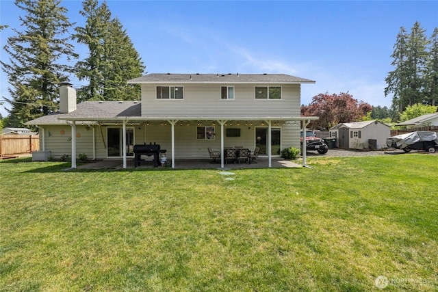2505 Angela St SE, Lacey, WA 98503 - rear view of house featuring a patio area and a chimney