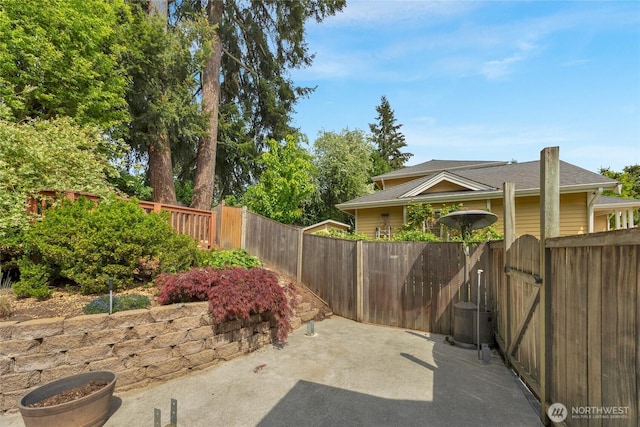 1401 241st St SE, Bothell, WA 98021 - view of yard with fence, a patio area, and a gate