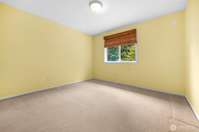 1401 241st St SE, Bothell, WA 98021 - spare room with light colored carpet and baseboards