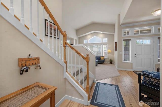 1401 241st St SE, Bothell, WA 98021 - entryway with plenty of natural light, wood finished floors, stairs, baseboards, and vaulted ceiling