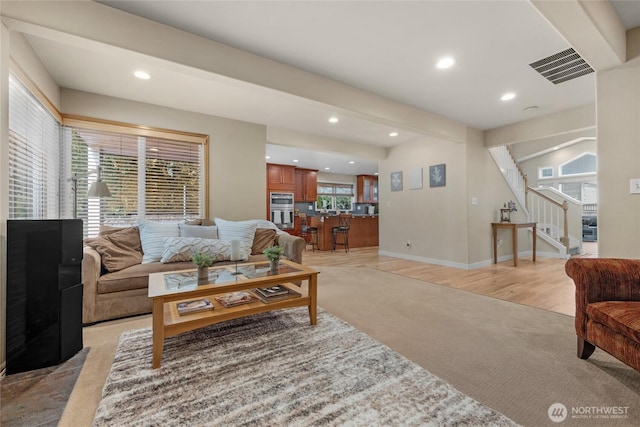 1401 241st St SE, Bothell, WA 98021 - living room featuring light carpet, stairs, recessed lighting, beamed ceiling, and baseboards