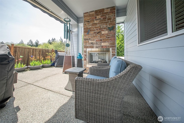5042 Mariner St, Gig Harbor, WA 98332 - view of patio with an outdoor brick fireplace and fence