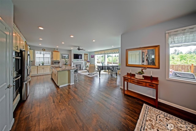 5042 Mariner St, Gig Harbor, WA 98332 - kitchen with open floor plan, stainless steel refrigerator with ice dispenser, healthy amount of natural light, dark wood finished floors, and recessed lighting