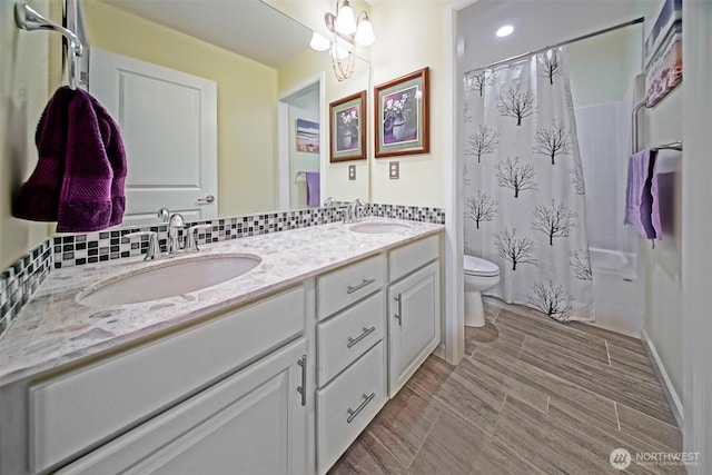 5042 Mariner St, Gig Harbor, WA 98332 - bathroom featuring toilet, double vanity, a chandelier, and curtained shower