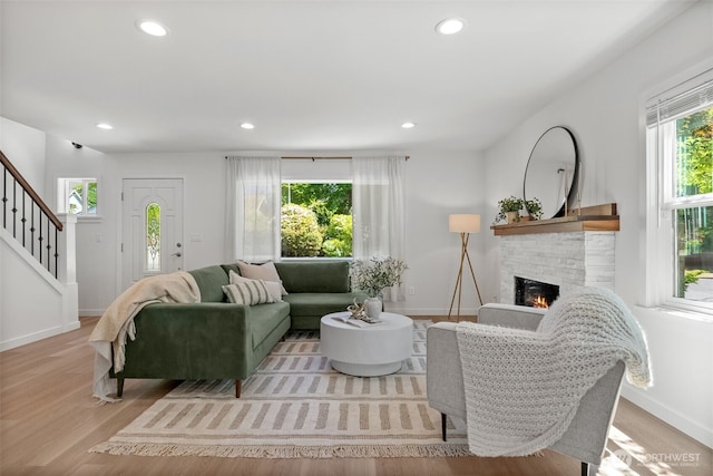 354 Summit Ave, Fircrest, WA 98466 - living room with a warm lit fireplace, recessed lighting, stairs, baseboards, and wood finished floors