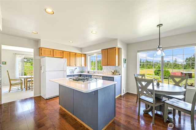 2470 Lee Way, Bellingham, WA 98226 - kitchen with white appliances, a sink, light countertops, dark wood-style flooring, and healthy amount of natural light