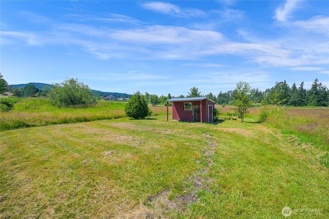 2470 Lee Way, Bellingham, WA 98226 - view of yard featuring a shed, an outbuilding, and a view of rural / pastoral area