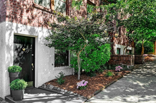 516 E Thomas St Unit 105, Seattle, WA 98102 - property entrance featuring stucco siding