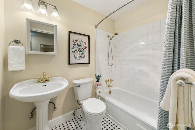 516 E Thomas St Unit 105, Seattle, WA 98102 - full bathroom with baseboards, shower / tub combo, toilet, and a sink