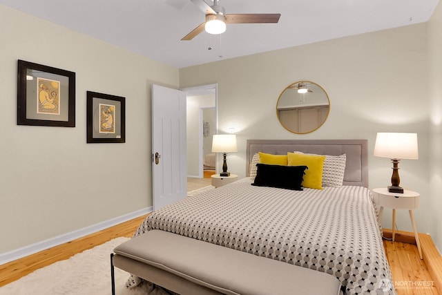516 E Thomas St Unit 105, Seattle, WA 98102 - bedroom with baseboards, wood finished floors, and a ceiling fan