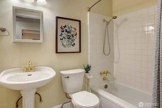 516 E Thomas St Unit 105, Seattle, WA 98102 - bathroom featuring toilet and shower / bath combo with shower curtain