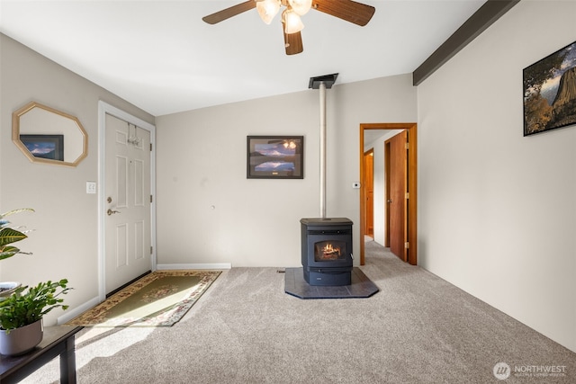 412 Algona Blvd S, Algona, WA 98001 - unfurnished living room with a wood stove, carpet floors, and ceiling fan