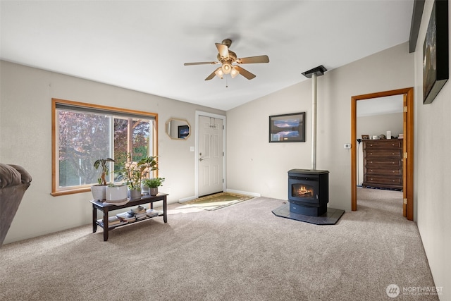 412 Algona Blvd S, Algona, WA 98001 - carpeted living area with a ceiling fan, a wood stove, and lofted ceiling