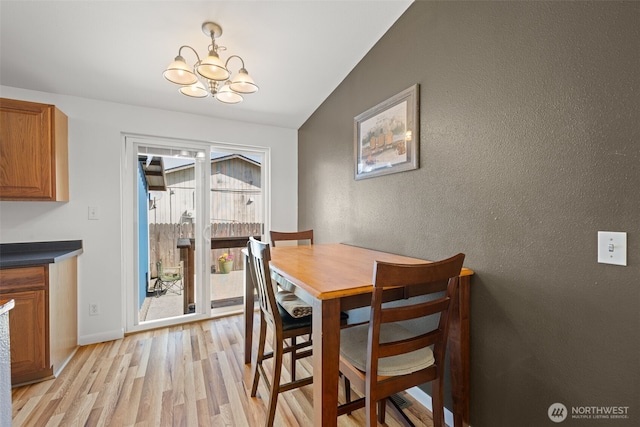412 Algona Blvd S, Algona, WA 98001 - dining area featuring a chandelier, light wood finished floors, and a textured wall