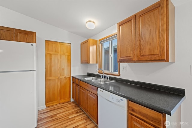 412 Algona Blvd S, Algona, WA 98001 - kitchen featuring white appliances, light wood-style floors, dark countertops, and brown cabinets