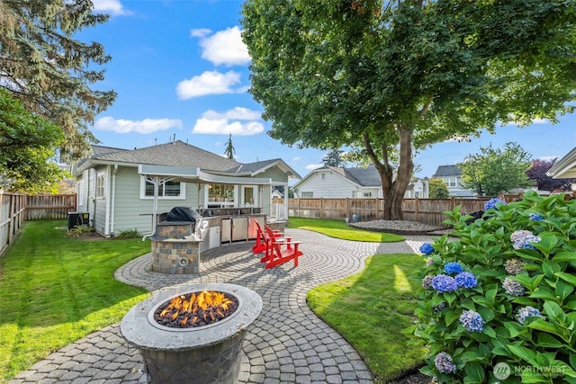 515 4th Ave SW, Puyallup, WA 98371 - view of yard with an outdoor fire pit, area for grilling, a patio area, and central air condition unit