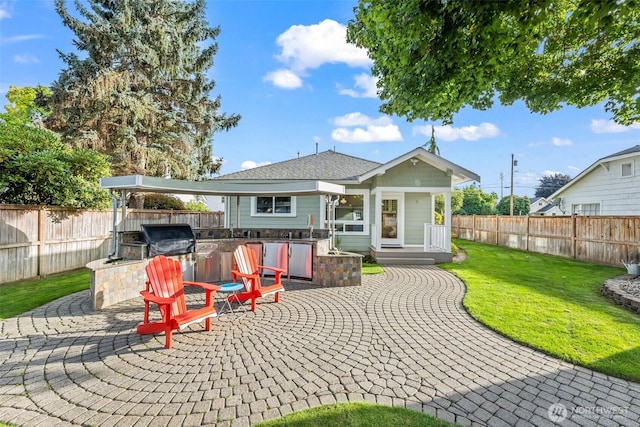515 4th Ave SW, Puyallup, WA 98371 - back of house featuring a patio area and an outdoor kitchen