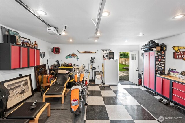 515 4th Ave SW, Puyallup, WA 98371 - garage featuring a garage door opener and recessed lighting