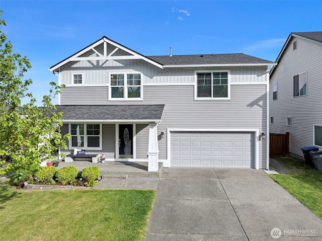 21032 Nordby Dr NW, Poulsbo, WA 98370 - traditional home with a garage, a porch, driveway, board and batten siding, and roof with shingles